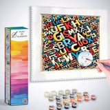 Paint by Numbers kit featuring a vibrant letter jungle design with letters in various colors and a hand painting the canvas.