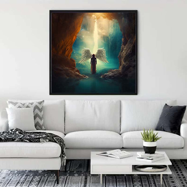 Diamond Painting - Angel Light Shine displayed on a living room wall above a white couch, featuring a luminous angelic figure.