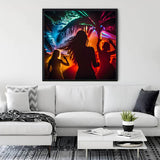 Diamond Painting - The Beach Dance artwork displayed in a living room, featuring colorful silhouettes dancing under palm trees with vibrant lights.