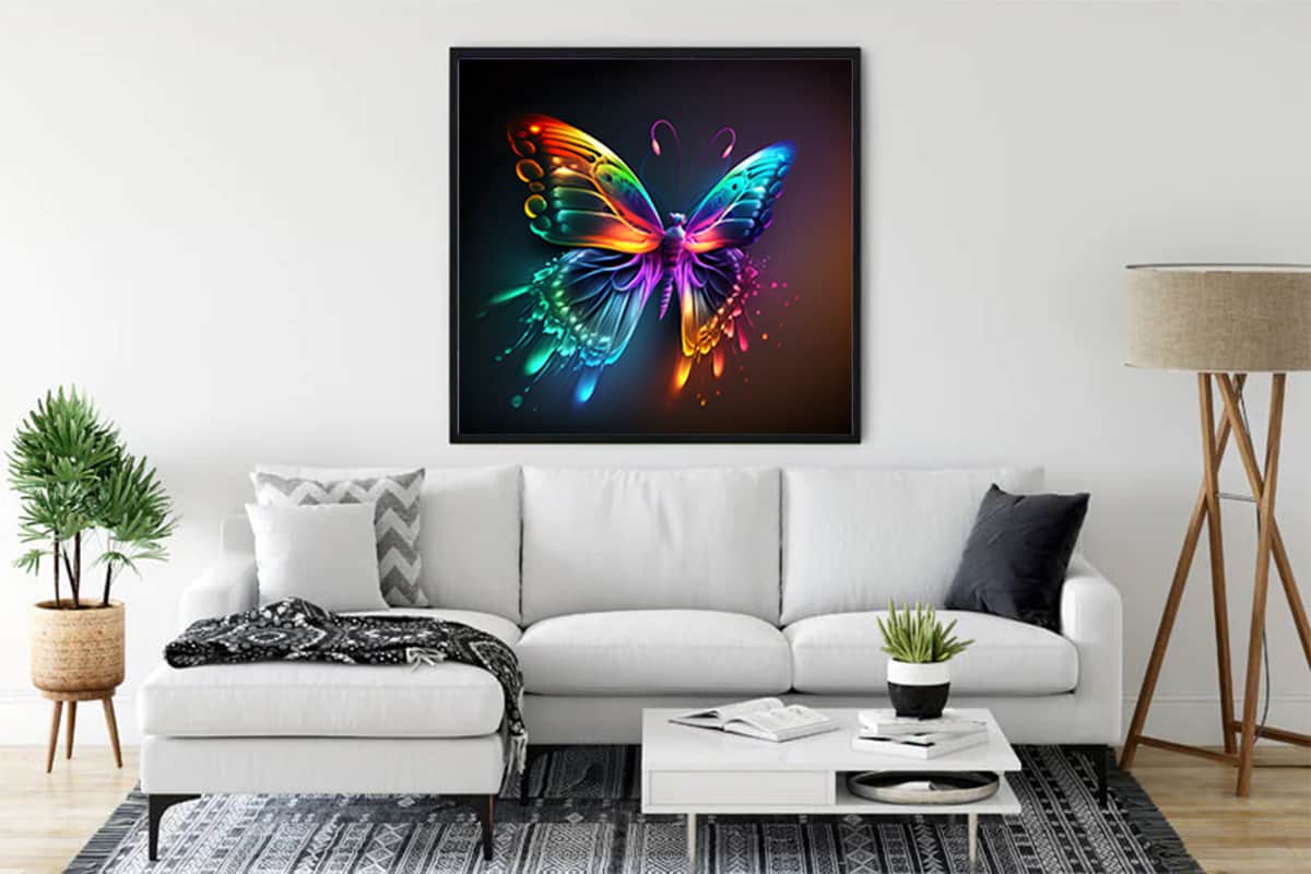 Diamond Painting Rainbow Butterfly artwork on canvas displayed in living room with white sofa and decor items.