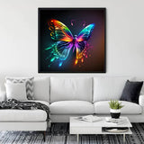 Diamond Painting Rainbow Butterfly artwork on canvas displayed in living room with white sofa and decor items.