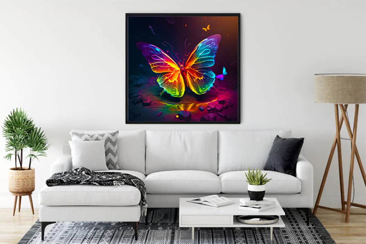 Framed neon butterfly diamond painting hanging in modern living room with white sofa and plants, showcasing colorful Paint by Numbers art.